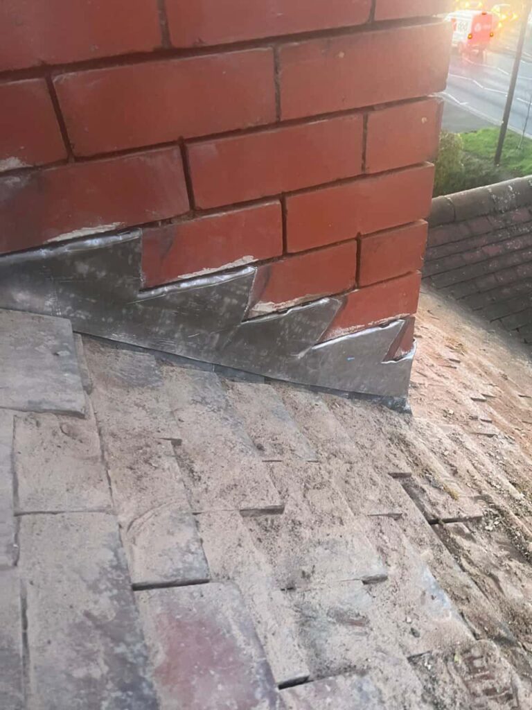 This is a photo of new leadwork being installed around an old chimney. Works carried out by Thurmaston Roofing Repairs